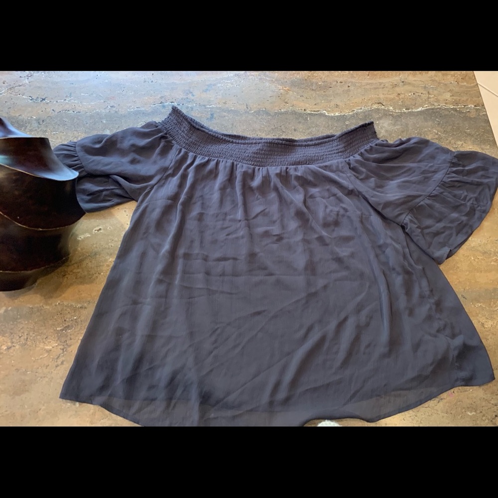 Gray Shirt. Sheer Material, but not see thru.